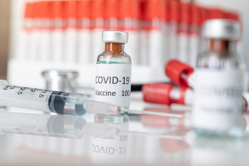 Nobel coronavirus covid-19 vaccine vial a illustrative picture, doctor in the laboratory with a biological tube for analysis and sampling of Covid-19 infectious disea.