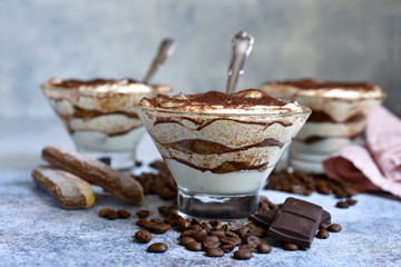 Traditional italian dessert tiramisu in a glasses.