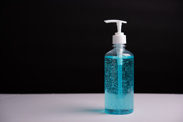 Plastic dispenser sanitizer alcohol gel pump bottle for washing hand hygiene prevention of coronavirus virus studio shot on black background
