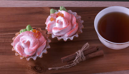 cakes and a cup of tea on a blackboard