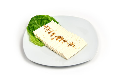 Cheese on a plate on white background.