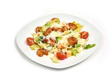Fresh salad with shrimp and parmesan cheese on round plate