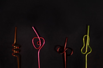 cocktail tubes on a black background