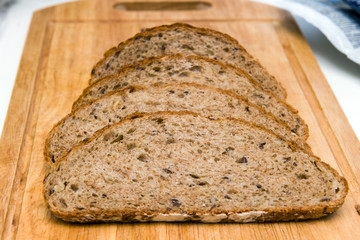 Slices of bread on a wooden board.