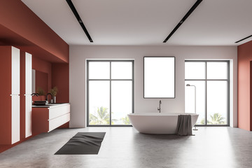 Orange and white bathroom with poster