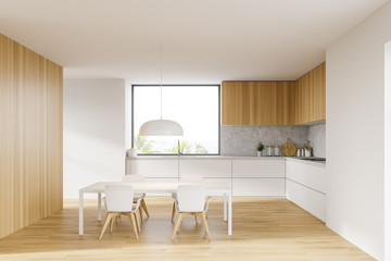 White and wooden kitchen, table and counters