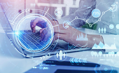 Hands typing on laptop, global online work