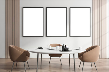 White dining room interior with poster gallery
