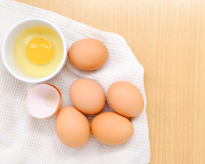 Close-up view of raw chicken eggs on background