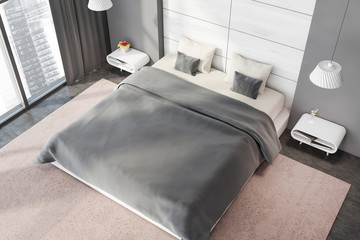 Gray and white bedroom with gray blanket, top view