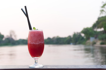 Ready-to-drink watermelon juice There is a top position behind the river and trees.