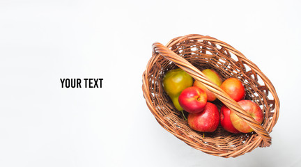 picnic basket filled with fruits on a white background. Top view. Copy space