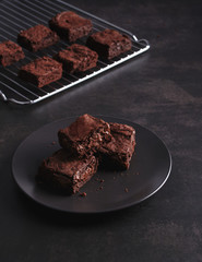 Brownies on dark table and Stainless cooking rack