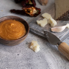 Almogrote, cheese paste form La Gomera, Canary Islands in wooden bowl on concrete table.