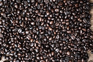 Roasted coffee bean on wooden texture