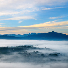 Sunrise in mountains, fog and cloud mountain valley landscape.