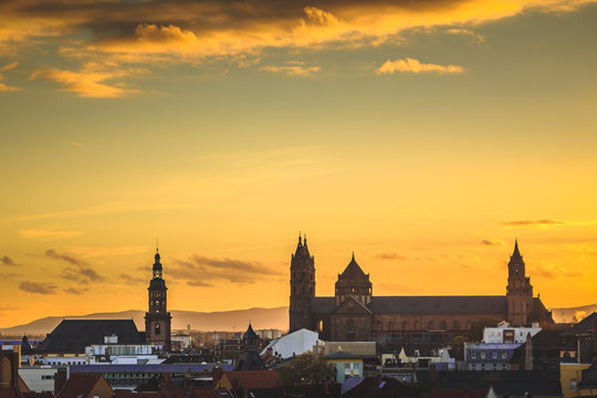 Wormser Dom By Buildings Against Sky During Sunset