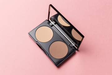 Mua and girly concept. Eyeshadow palette on pink background, eye shadows cosmetics product as...