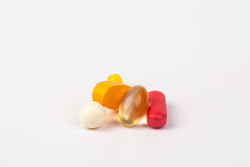 Close up of medicines pills and tablets on white background.