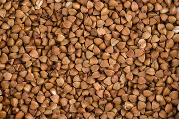 Scattered buckwheat background / Close-up buckwheat background.
