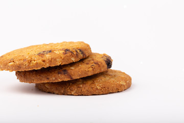 Delicious Oat cookies raisins with wholegrain on a white background.