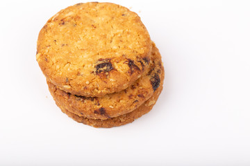 Delicious Oat cookies raisins with wholegrain on a white background.