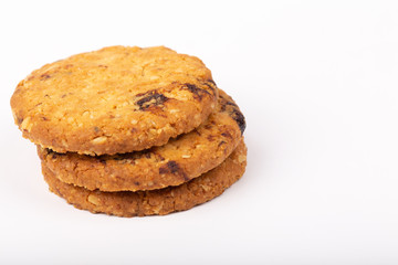 Delicious Oat cookies raisins with wholegrain on a white background.