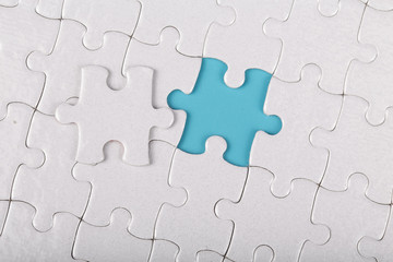 Fototapeta premium The last piece of white jigsaw puzzle.