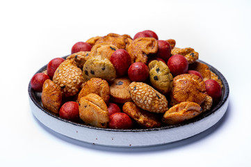 Tasty asian vegetarian appetizer, crunchy rice en peanuts snacks from Japan isolated on white backgound