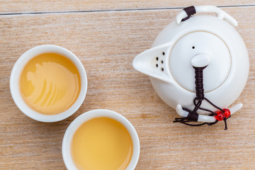 Man hand pouring Tea on Chinese tea cup. Chinese Traditional culture of Traditional Tea Ceremony Utensils, Chinese Teacup
