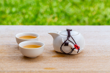 Man hand pouring Tea on Chinese tea cup. Chinese Traditional culture of Traditional Tea Ceremony Utensils, Chinese Teacup
