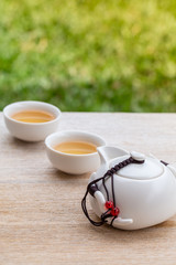 Man hand pouring Tea on Chinese tea cup. Chinese Traditional culture of Traditional Tea Ceremony Utensils, Chinese Teacup
