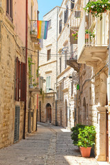 Fototapeta na wymiar A narrow street in the village of Molfetta in Puglia 