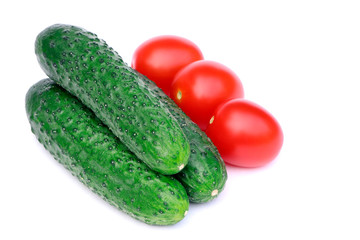 Organic, raw vegetables isolated.Tomatoes and cucumbers isolated on a white background.