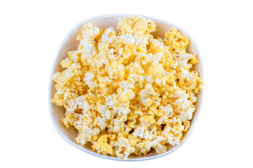 Popcorn in a white bowl top view. Fresh pop corn in white blow isolated on white background. White Salty popcorn a full bowl.