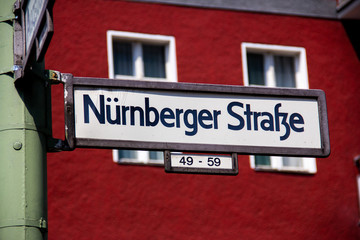 A street sign in Berlin, Germany, with the name Nürnberger Strasse, on it.