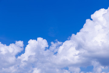 Naklejka na ściany i meble Blue sky background with white clouds on sunny day.