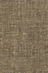 The texture of the Fabric Is made Of coarse beige Burlap.