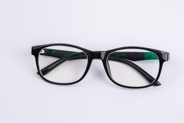 Close up black eye glasses isolated on white background