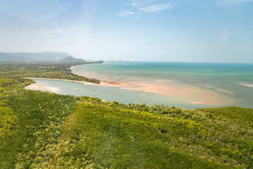 Great Barrier Reef Beach. Blue Sea, sand, ocean view. Beautiful aqua & turquoise waters, with sand patterns in the ocean. View from helicopter, on vacation. Tropical paradise, holiday island concepts.