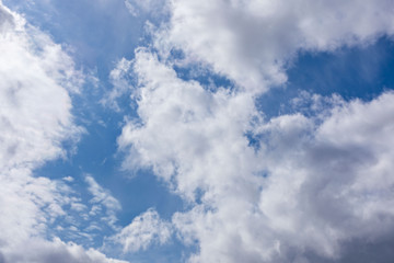 Obraz premium Background of natural blue sky with white clouds and light of sun.