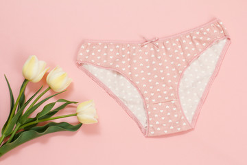 Beautiful women's cotton panties on a pink background.