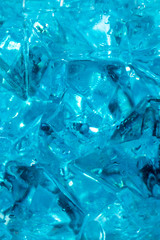 texture of ice on blue backgrouTexture and background of blue crystals with ice in drops of fresh water. Classic blue background.nd