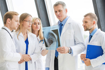 Team of expert doctors with x-ray