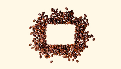 Frame of roasted brown coffee beans isolated on white may use as background or texture.