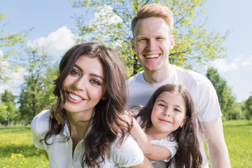 Naklejka premium Happy family in spring park