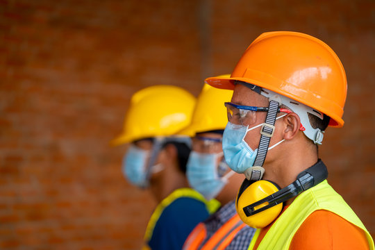 Technician wear protective face masks safety for Coronavirus Disease 2019 (COVID-19) in machine industrial factory,Coronavirus has turned into a global emergency.