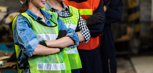 Obraz premium industry engineer team Asian wearing uniform and hard hats at Metal lathe industrial manufacturing factory. Engineer Operating lathe Machinery