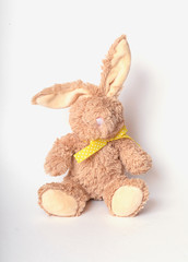 Rabbit plushie doll isolated on white background. Rabbit plush stuffed, Cute brown rabbit on white background.