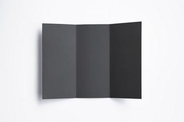 Black closed Tri fold brochure isolated on white. illustration for your design presentation.